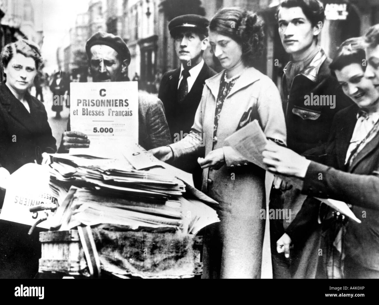 Distribution of the first official lists of wounded and captured French people, Paris, 25 July 1940. Artist: Unknown Stock Photo