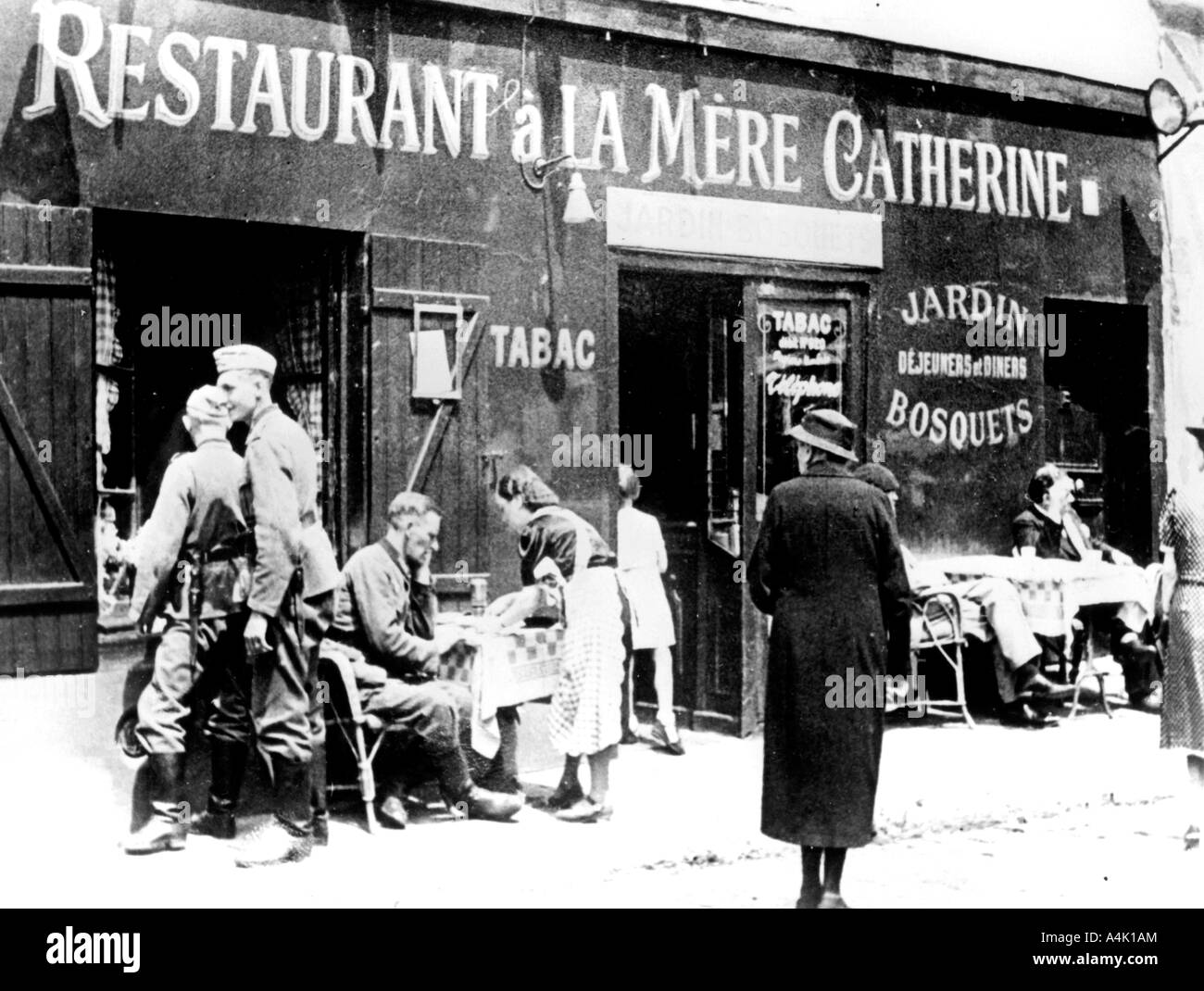 German soldiers at a restaurant, occupied Paris, June 1940. Artist: Unknown Stock Photo