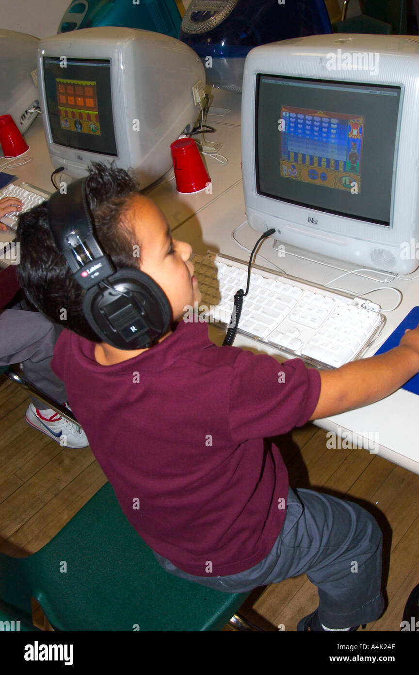 Hispanic boy at school computer hi-res stock photography and images - Alamy