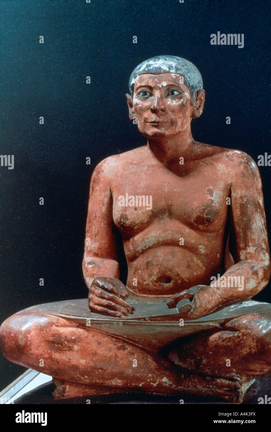 Ancient Egyptian figure of a seated scribe, 25th-24th century BC. Artist: Unknown Stock Photo
