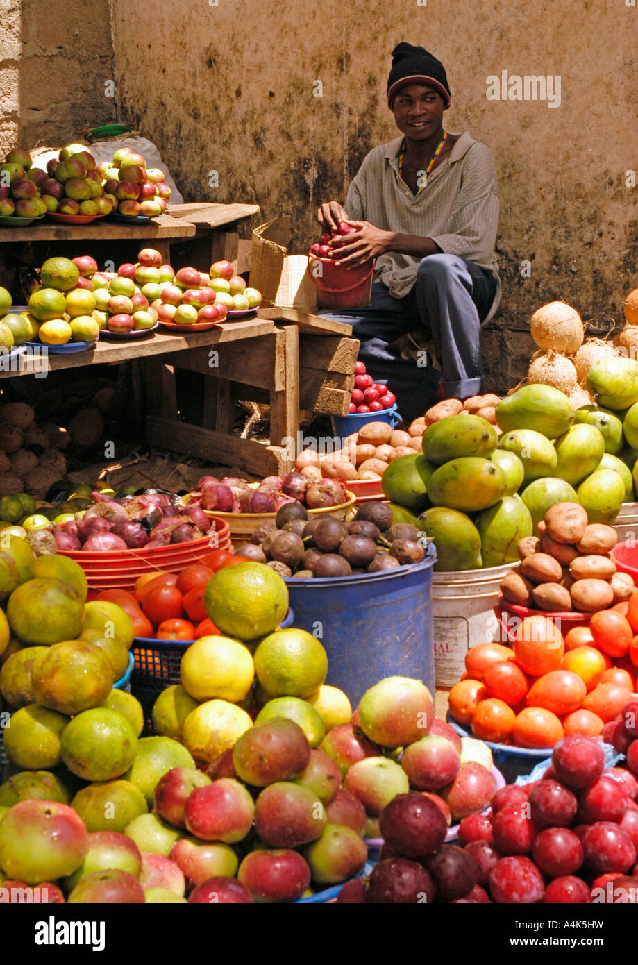 Man selling tropical fruits in a bus station, Mombo, Tanzania Stock Photo