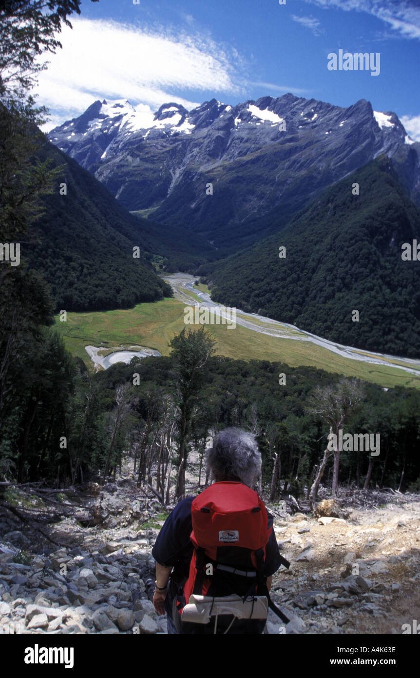 Walker near Routeburn Falls Hut Routeburn Track Fiordland National Park Southland South Island New Zealand Stock Photo