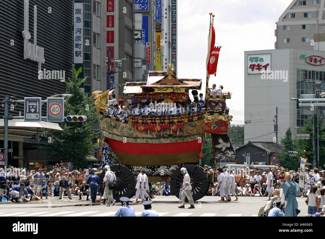 A boat shaped float is pulled during the main parade at the Gion
