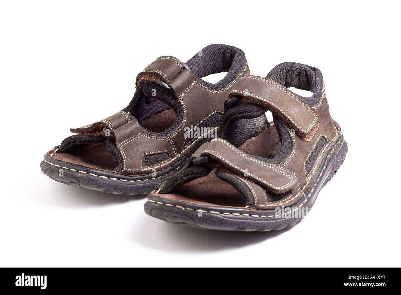 A pair of leather hiking sandals isolated on a white background Stock