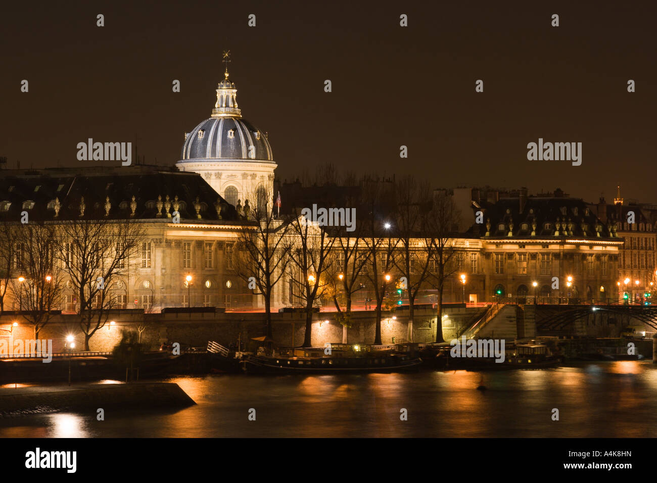 The French Institute and the Seine river at night - Paris, France Stock Photo