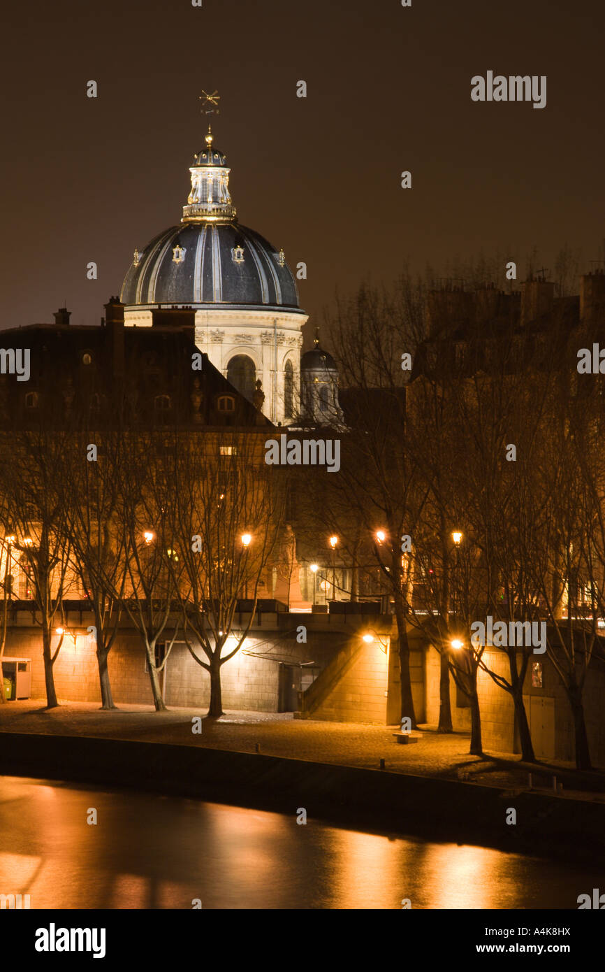 The French Institute and the Seine river at night - Paris, France Stock Photo