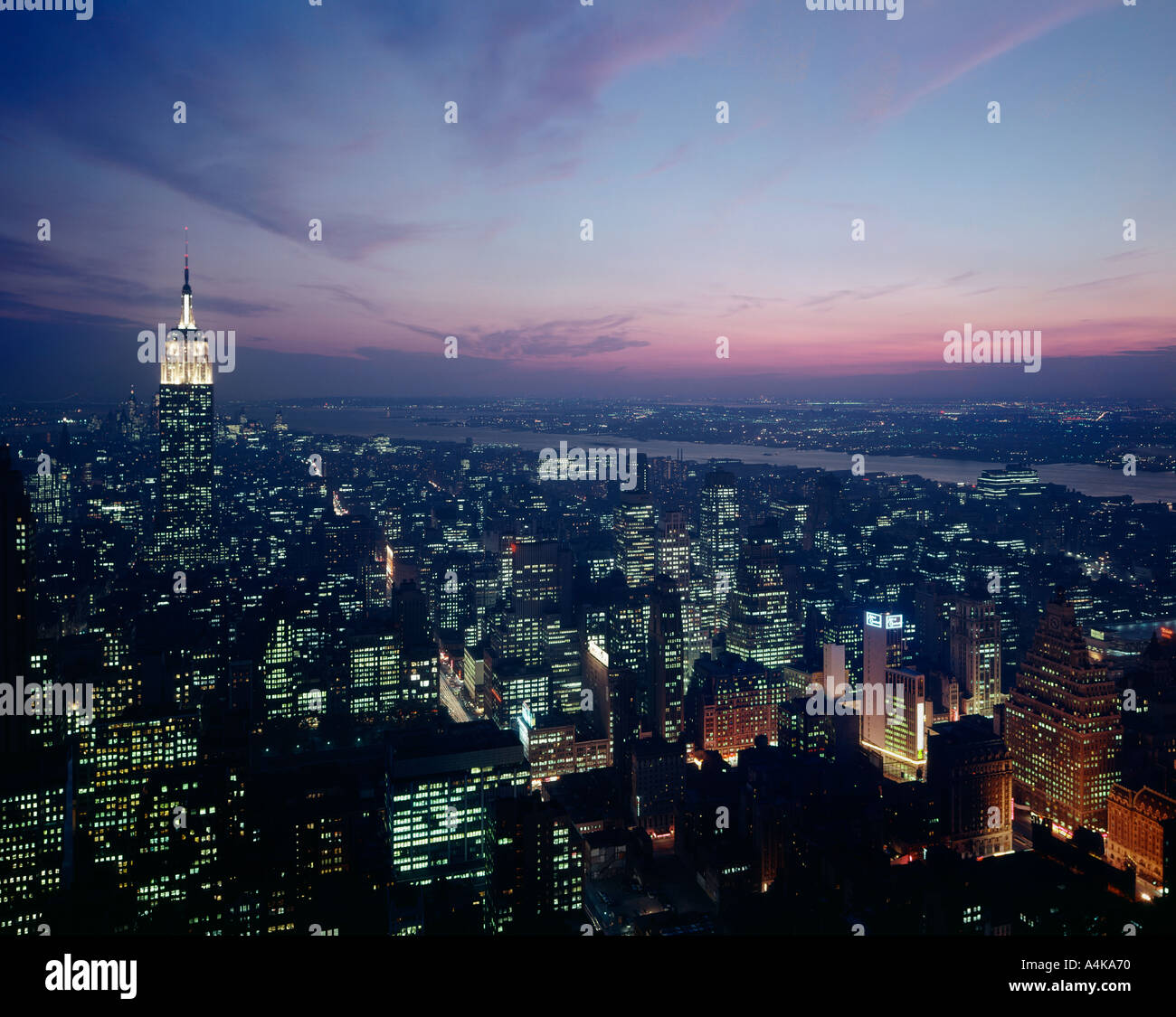 Empire State Building and New York skyline at night Stock Photo - Alamy