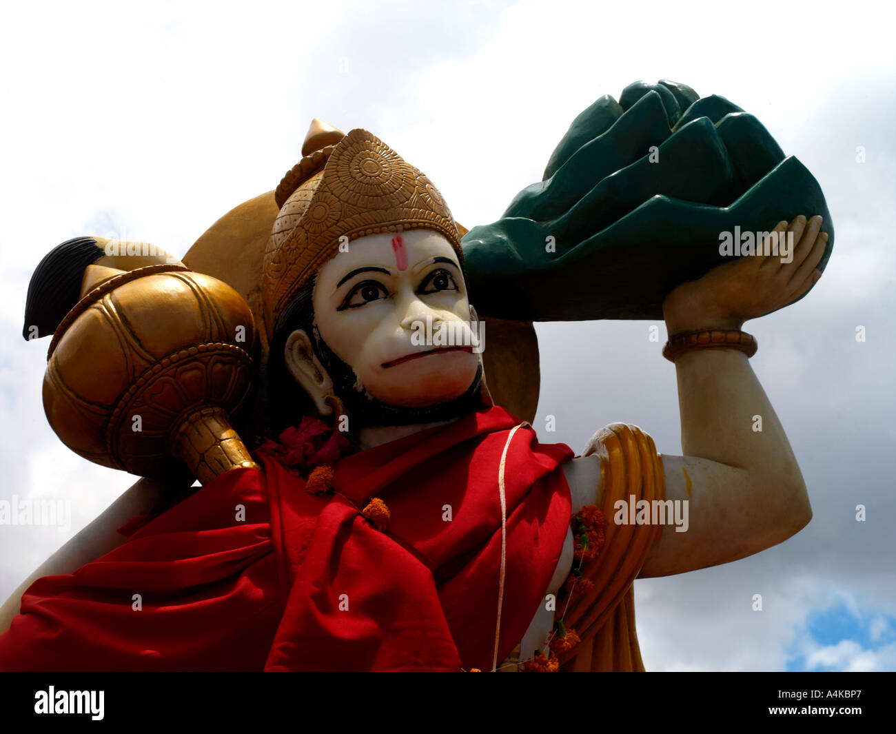 Ganga Talao Grand Bassin Mauritius Hanuman Son of Vaya God of the Wind in Hindu Temple Holding the Gada and Dronagiri Parvat Stock Photo