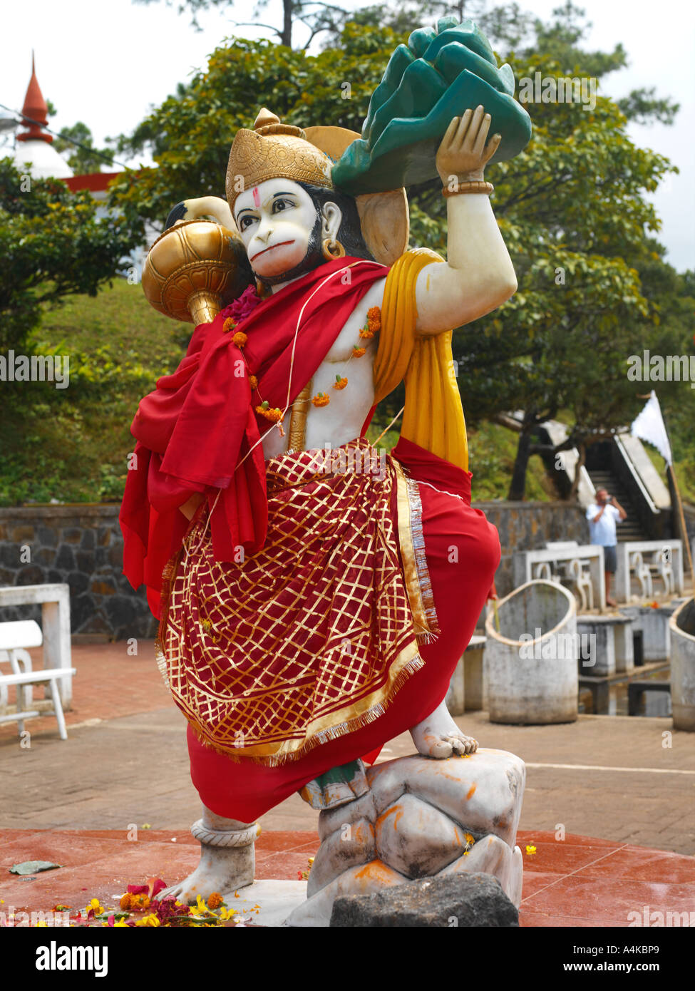 Ganga Talao Grand Bassin Mauritius Hanuman Son of Vaya God of the Wind in Hindu Temple Holding the Gada and Dronagiri Parvat Stock Photo