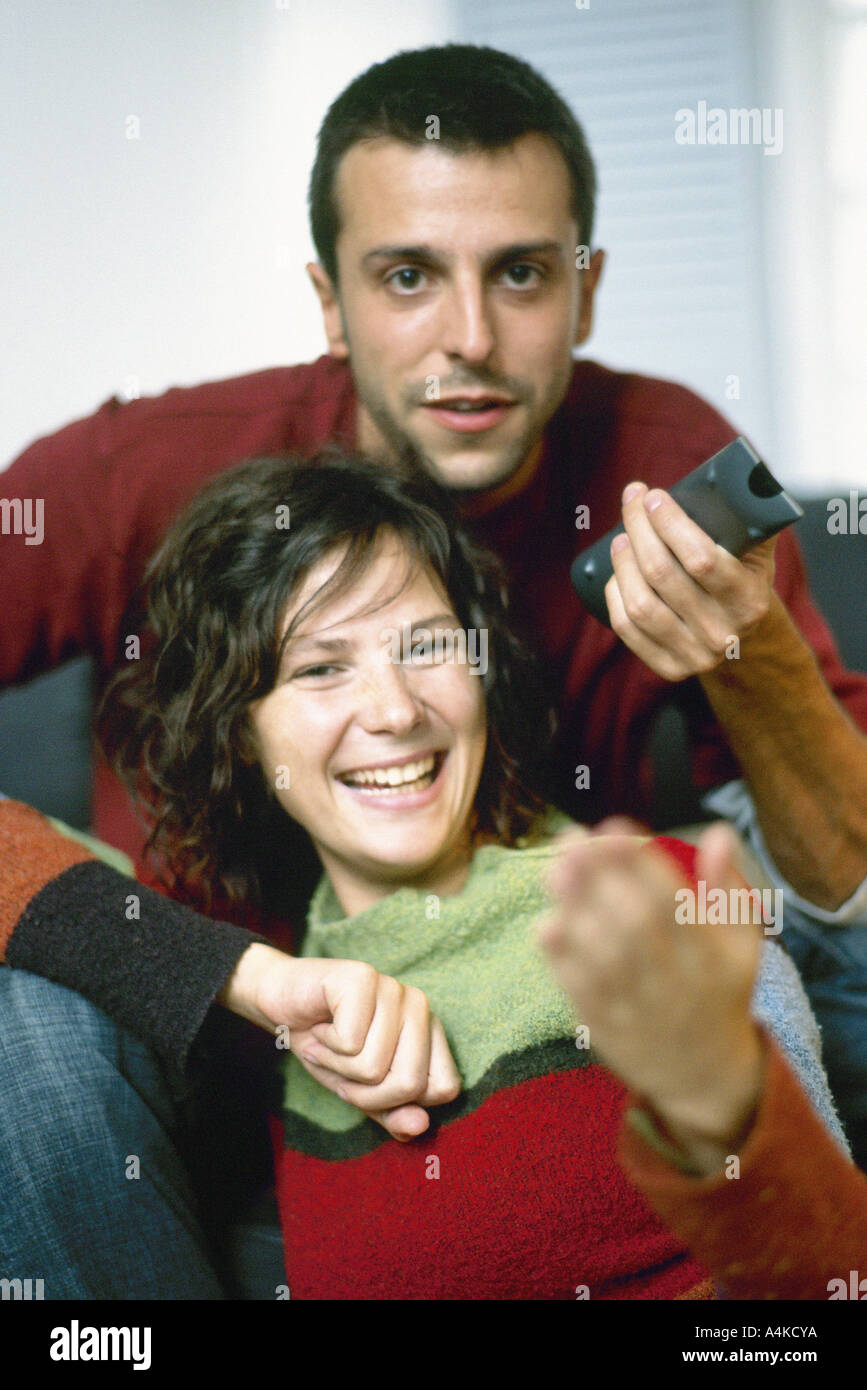 Young couple with remote control Stock Photo