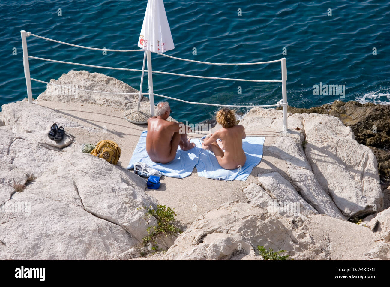 Naturist Sunbathers on beach in Croatia near dubrovnik Stock Photo - Alamy