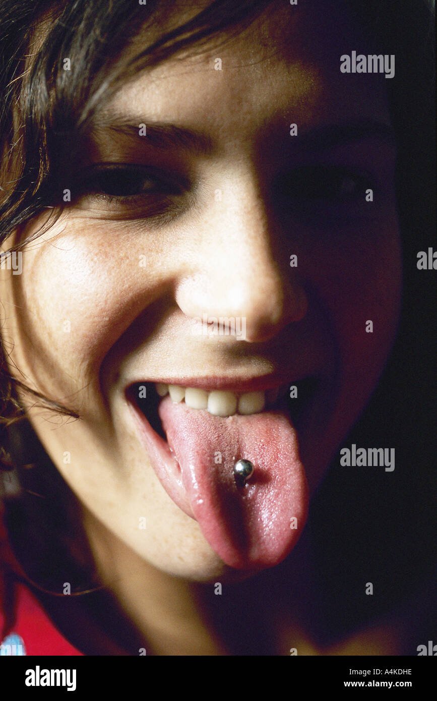 Young woman showing tongue piercing Stock Photo