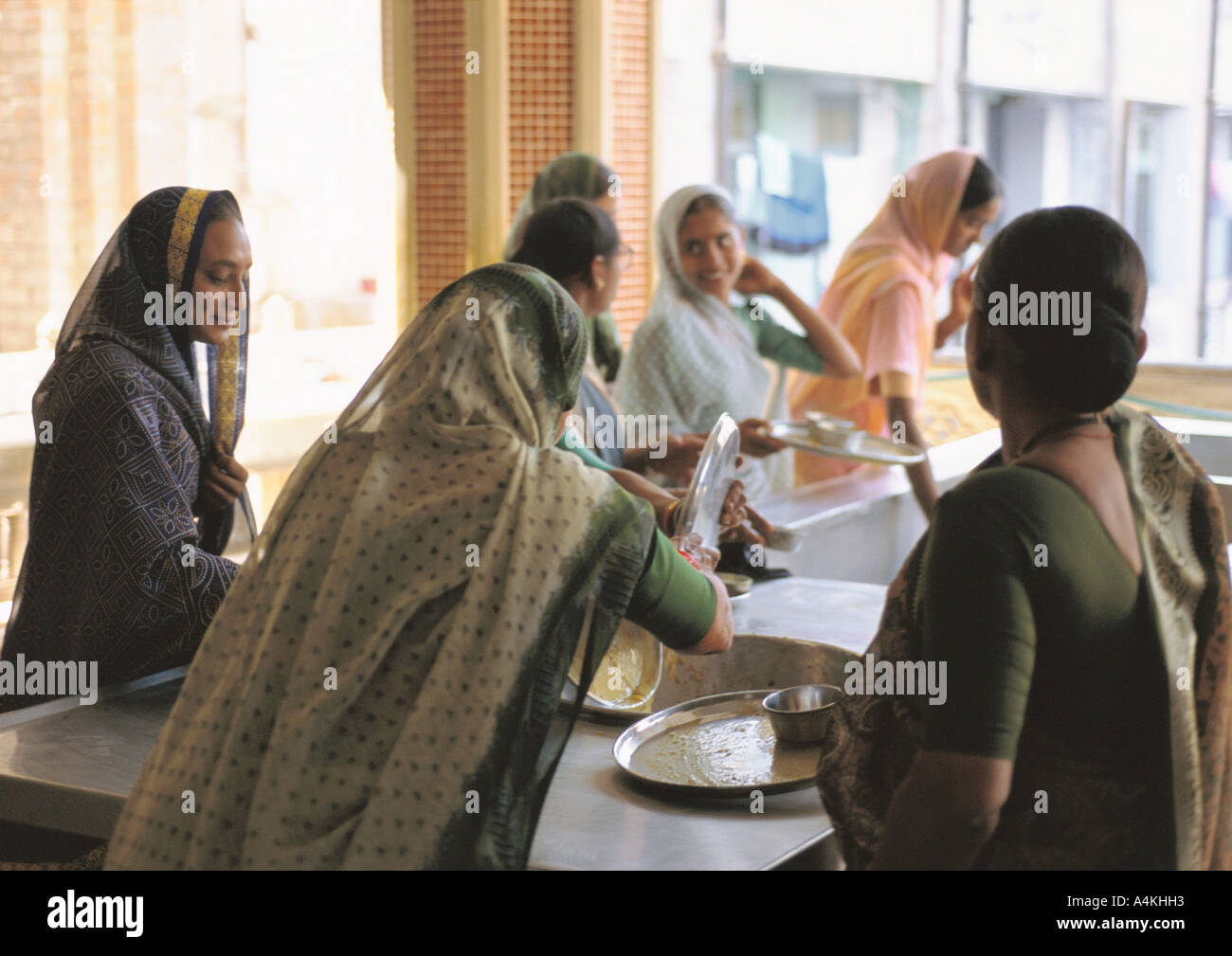 India, Ahmedabad, women doing dishes Stock Photo