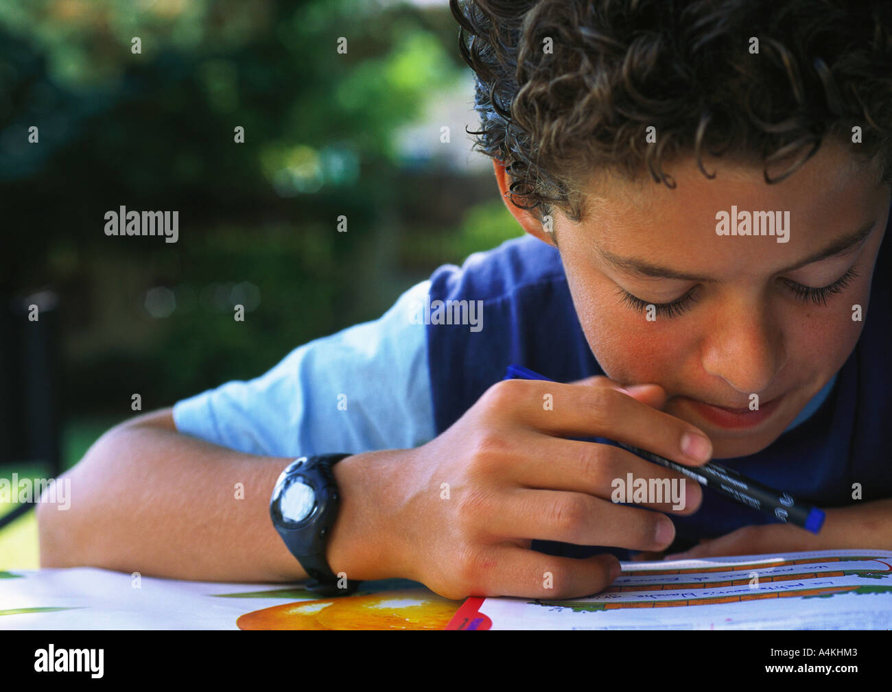 Boy doing homework Stock Photo