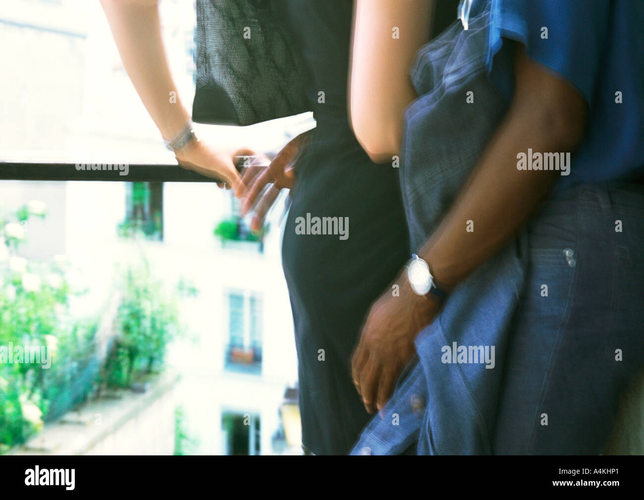 Man and woman embracing, mid-section Stock Photo