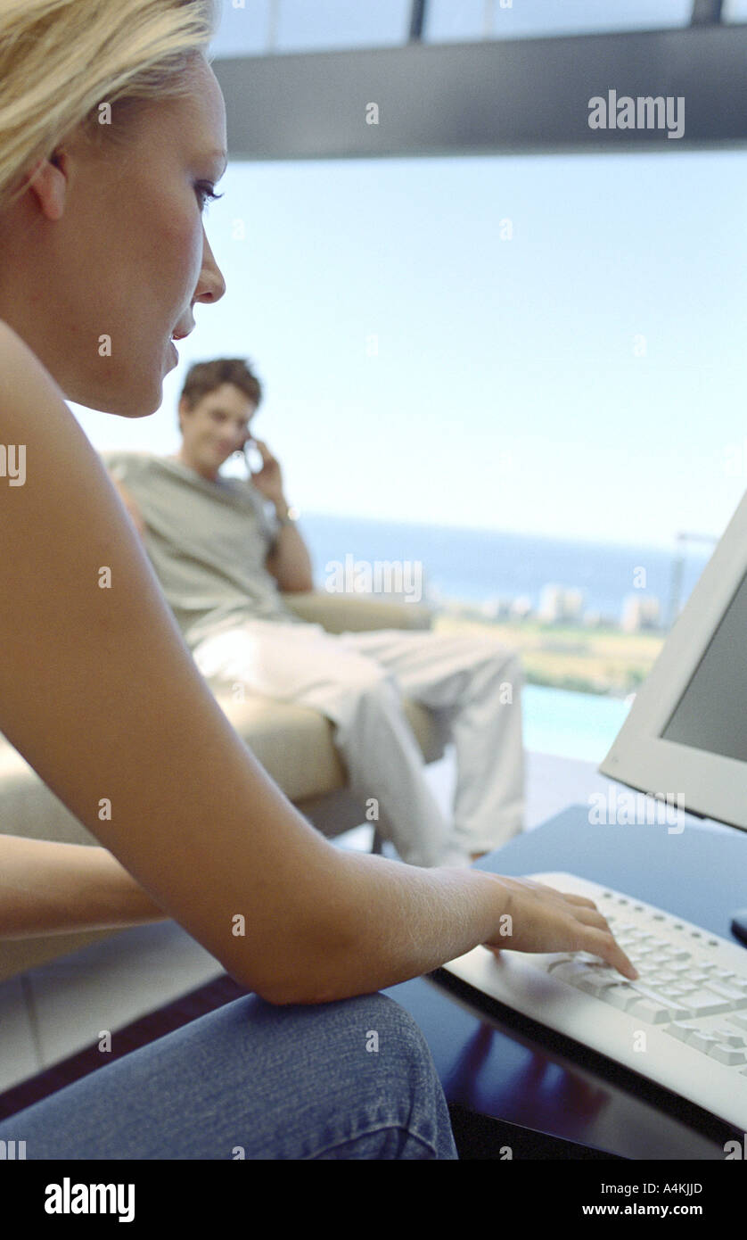 Man sits computer typing talking hi-res stock photography and images ...