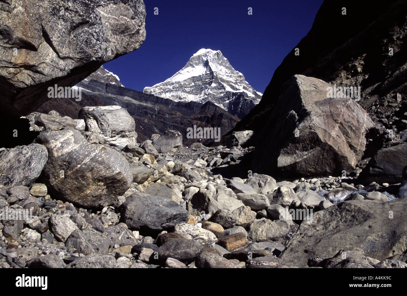 Looking up the Hinku Valley to the sacred mountain Peak 43 in the Himlaya Nepal Stock Photo