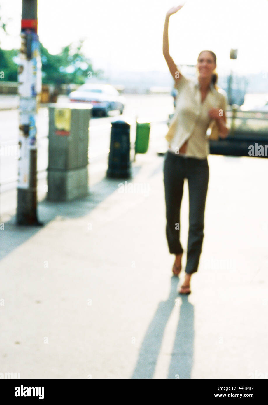 Woman walking arms raised hi-res stock photography and images - Alamy
