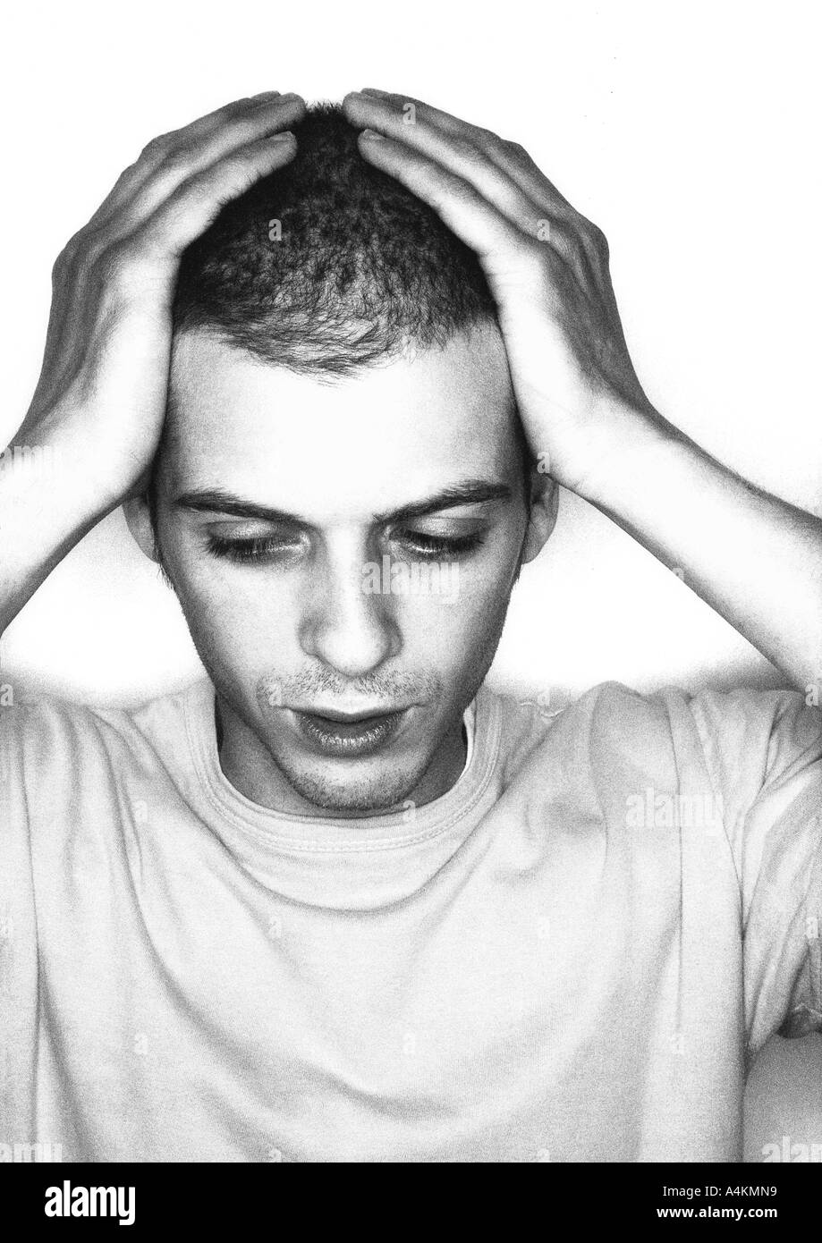 Man, hands on head, portrait, b&w. Stock Photo