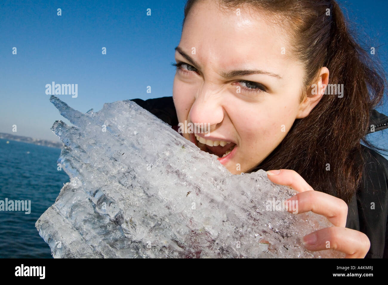 Young woman in the quay harbor of Geneva lake going to eat ice Stock Photo