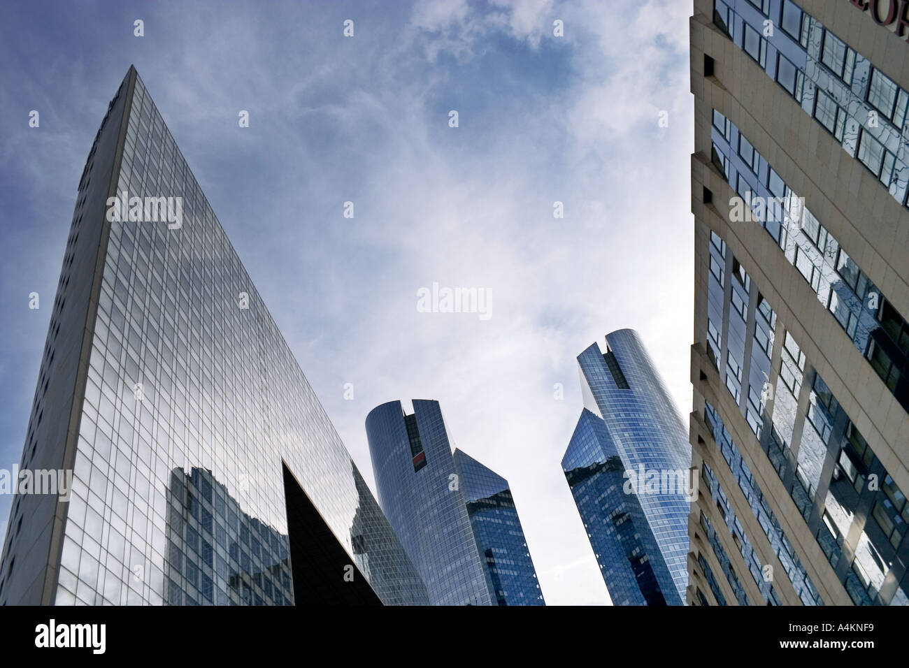 Business offices skyscrapers seemingly converging La Defence area Paris France Europe wide angle view from the ground Stock Photo
