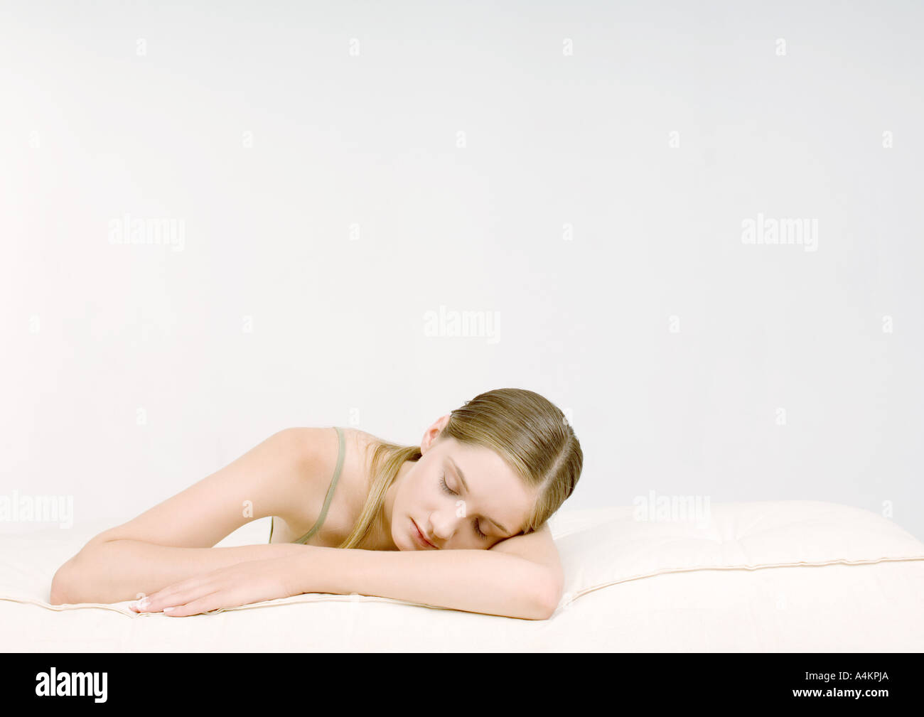 Woman lying with head on arm Stock Photo Alamy