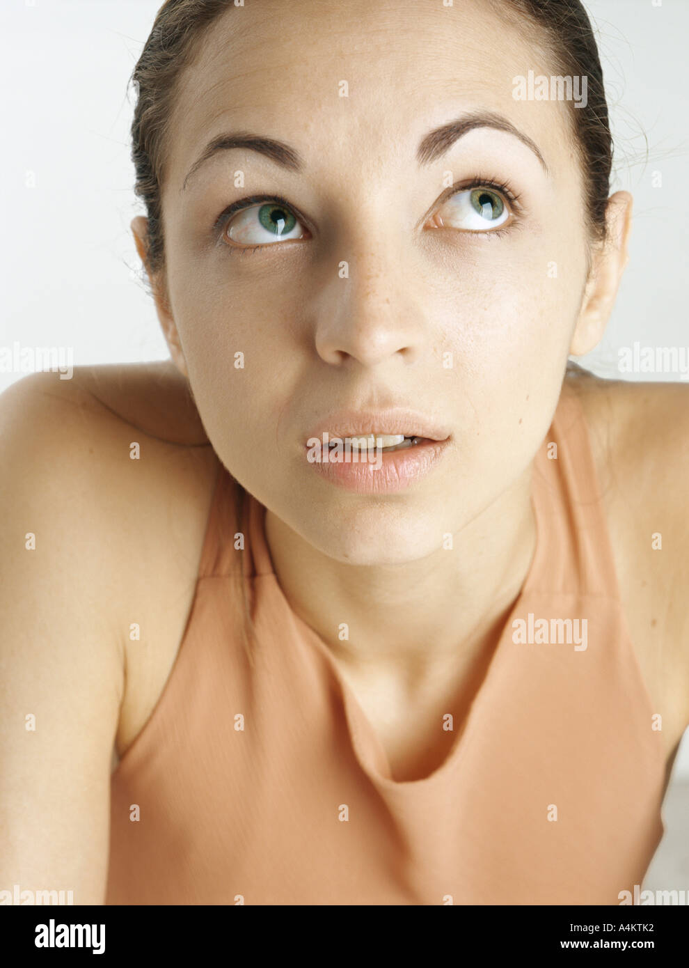 Woman looking up with raised eyebrows, closeup Stock Photo Alamy