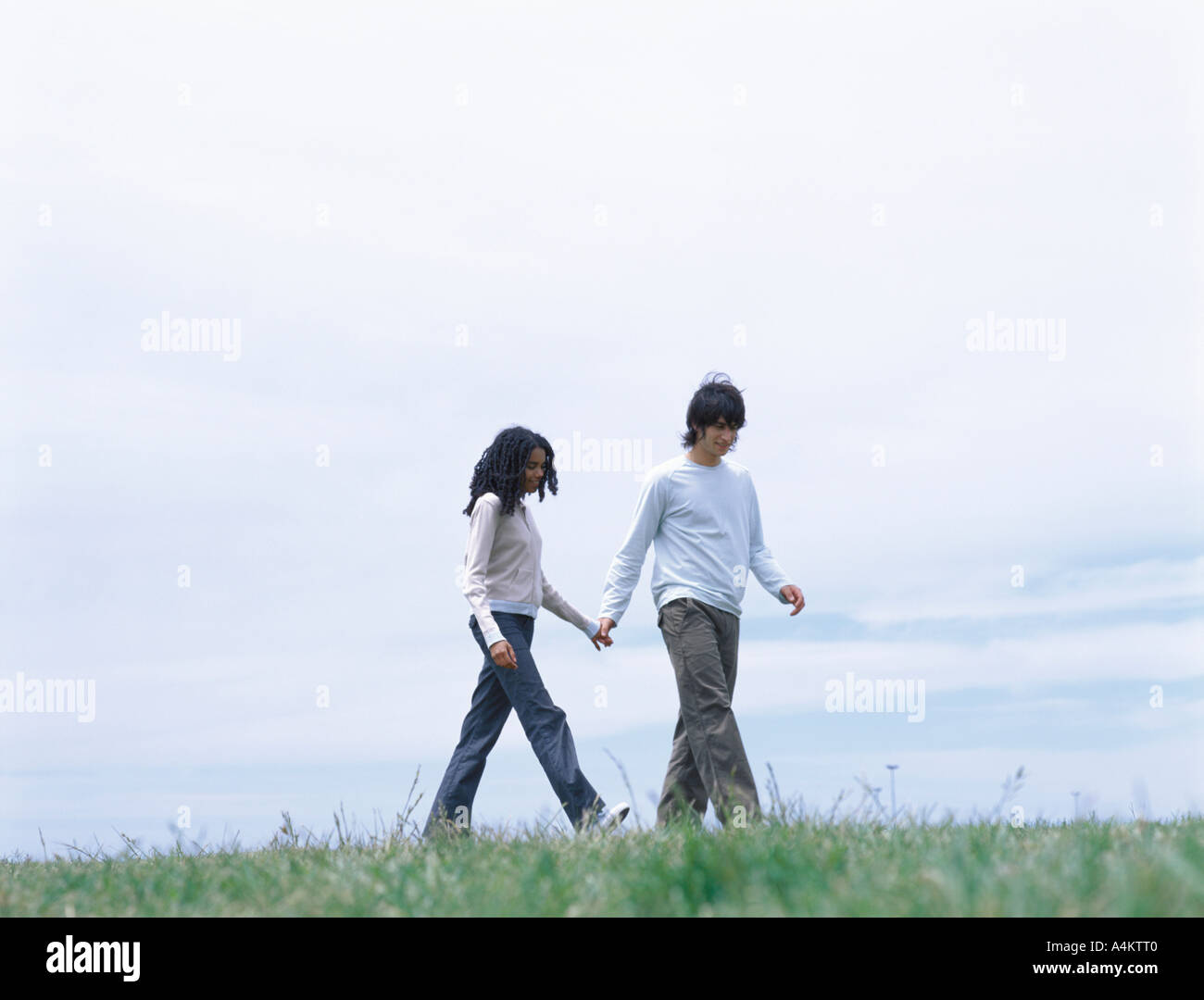 Young man woman holding hands hi-res stock photography and images - Alamy