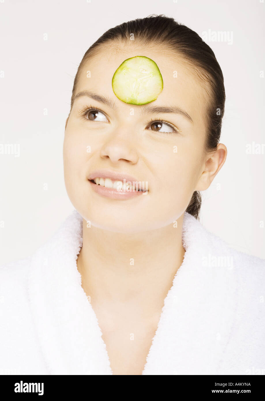 Woman with cucumber slice on forehead Stock Photo Alamy