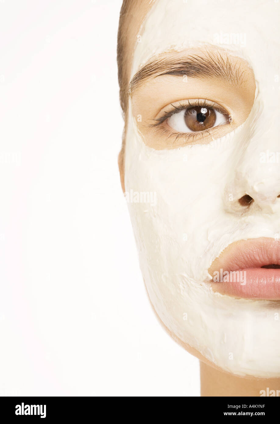 Woman with facial mask, extreme close-up Stock Photo