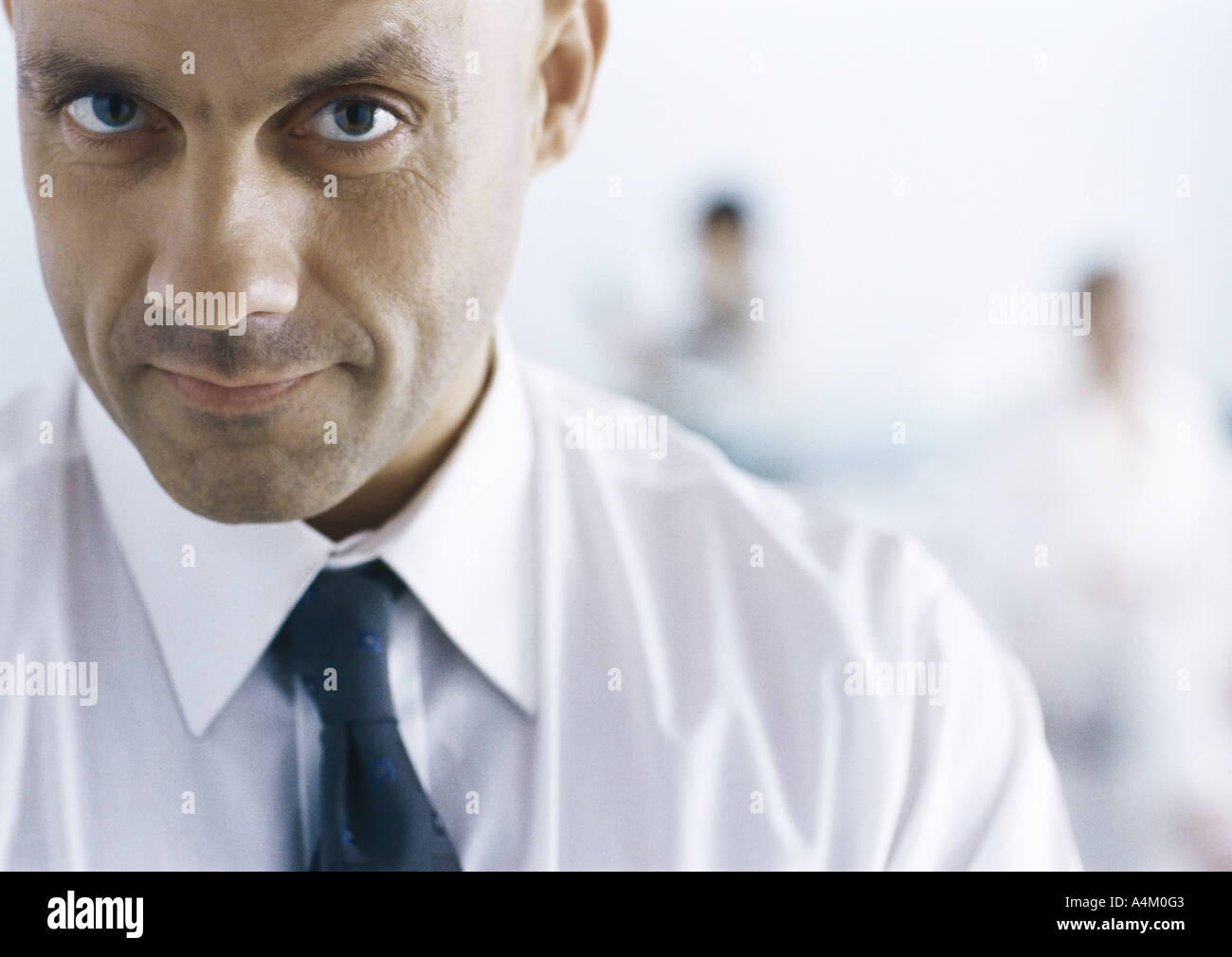 Businessman looking at camera with eyebrow raised Stock Photo