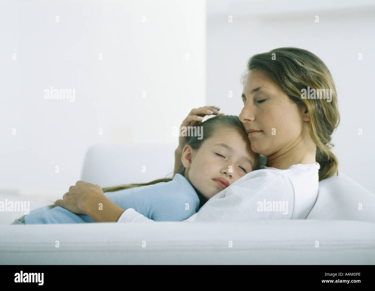 Girl sleeping on woman's chest Stock Photo Alamy