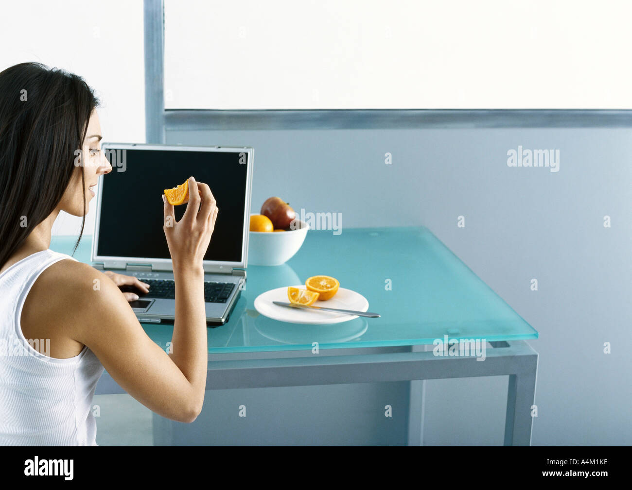 Young woman casual laptop profile desk hi-res stock photography and ...
