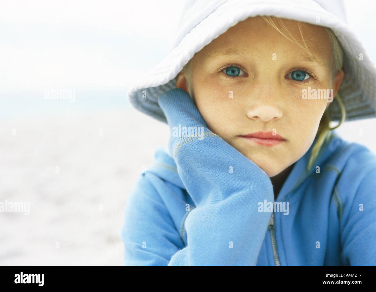 Little girl wearing hat on beach, portrait Stock Photo Alamy