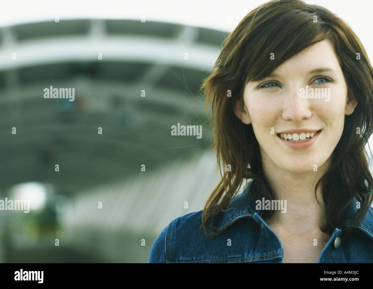 Young woman standing in front of tunnel Stock Photo