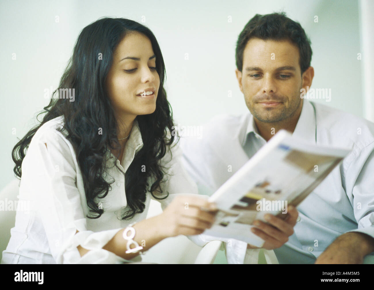 Couple looking catalogue hires stock photography and images Alamy