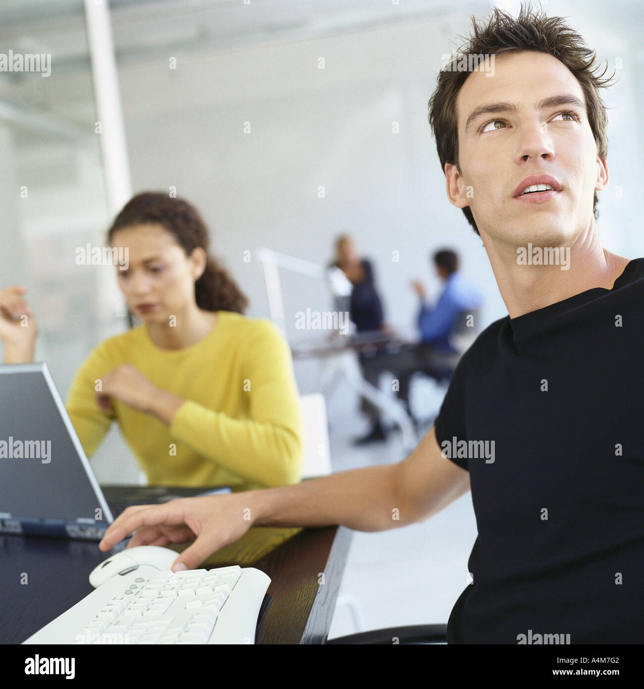 Casually dressed people working in office Stock Photo
