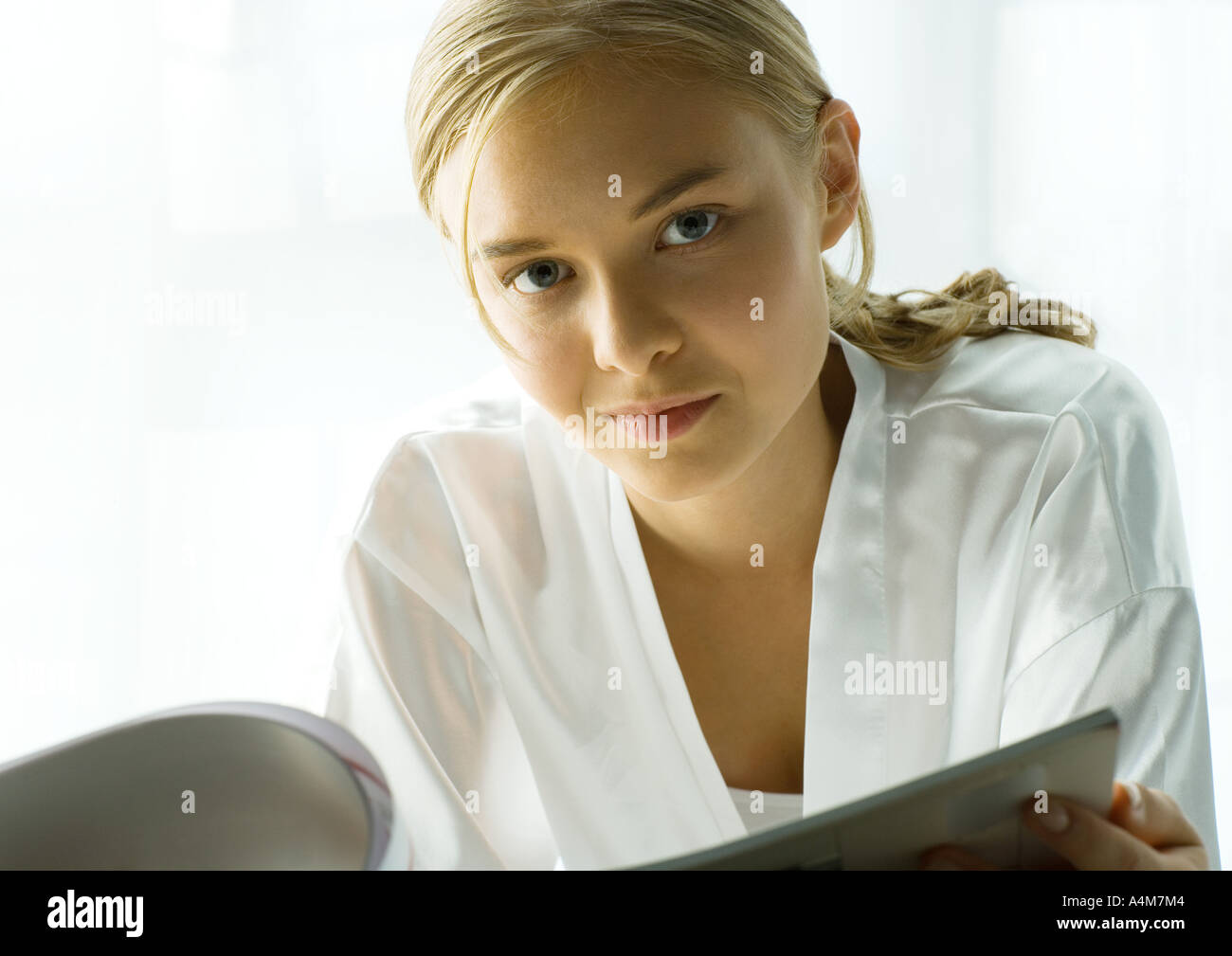 Young woman with magazine Stock Photo