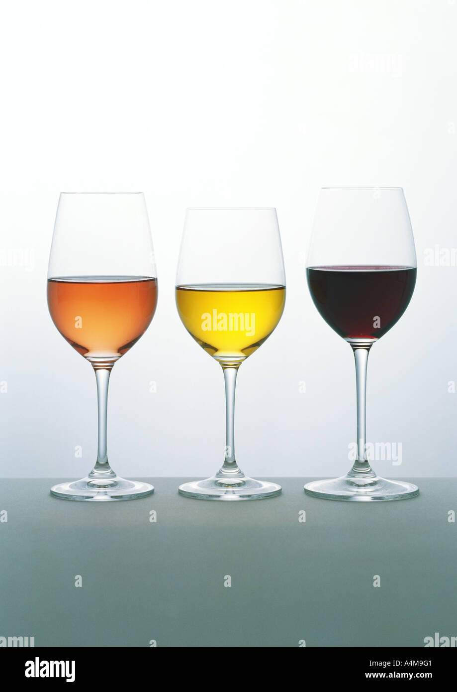 Glasses of white, rosŽ and red wines Stock Photo