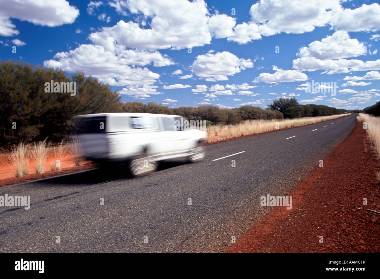 A white van on the Luritja road to Watarrka National Park in the Northern Territories of Australia. Stock Photo