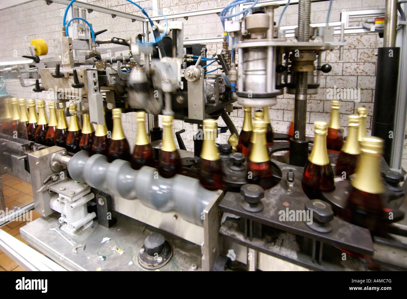 Bottling machinery in the Carl Jung winery in Schloss Boosenburg in Rüdesheim am Rhine in the Hessen Province in Germany. Stock Photo