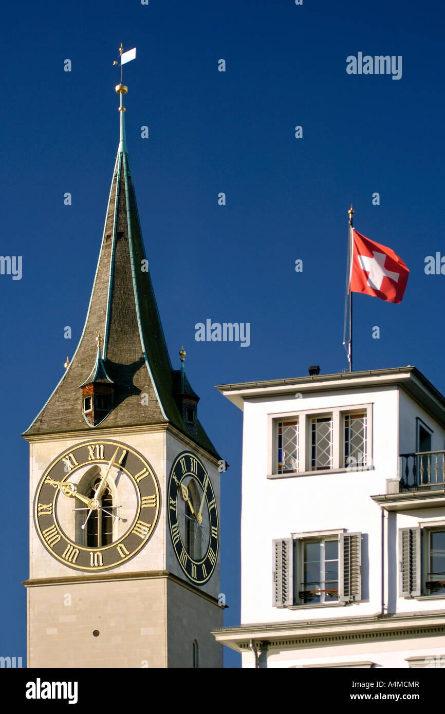 The clock tower and steeple of St Peter's church in Zürich Switzerland
