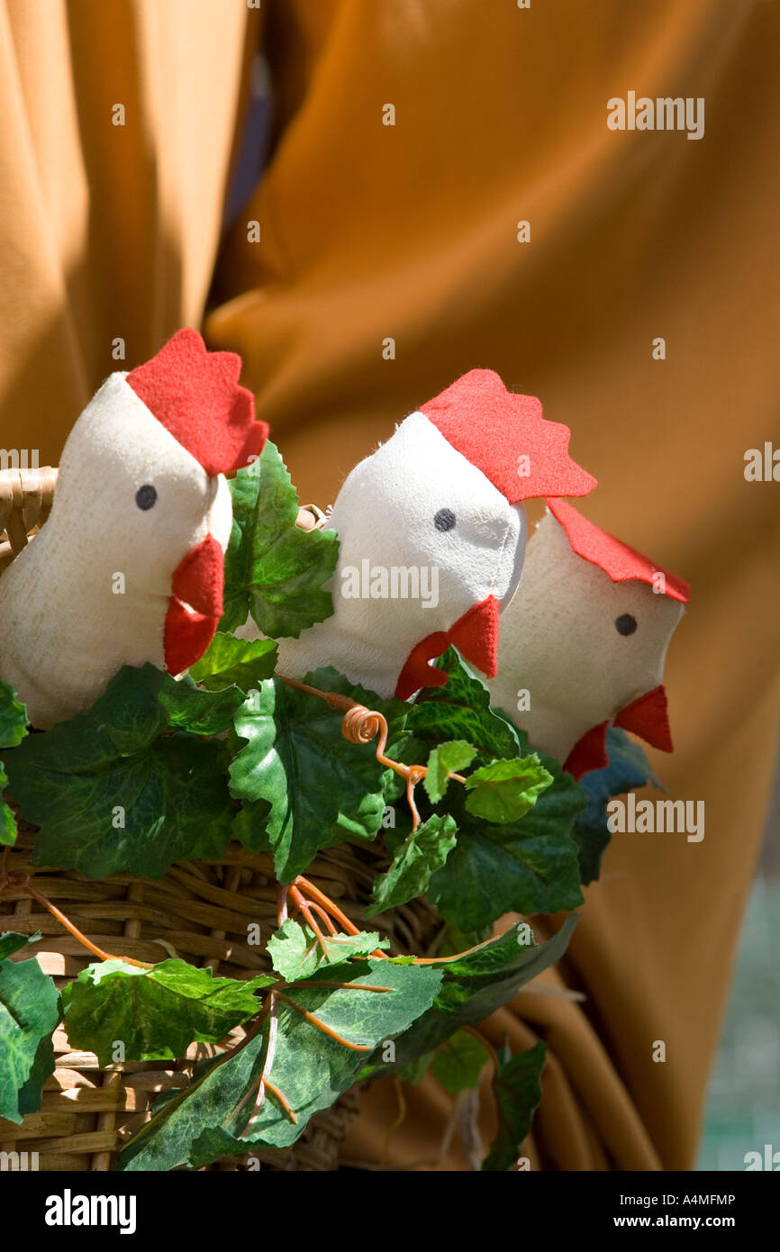 Toy hickens in basket held by gigante (giant) during parade, VitoriaGasteiz, Fiesta de la