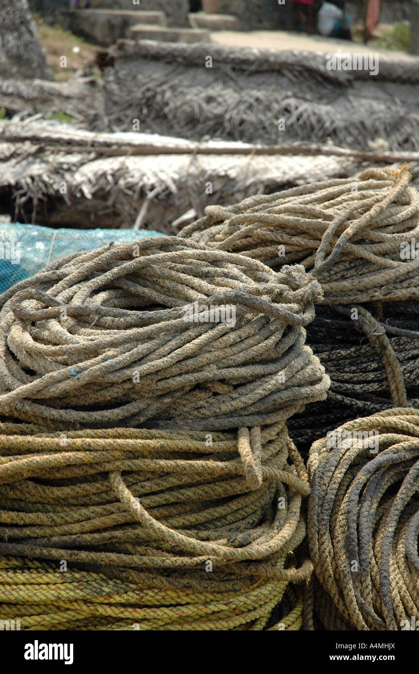 Rope piles on beach by fishing boats in Kerala India Stock Photo - Alamy