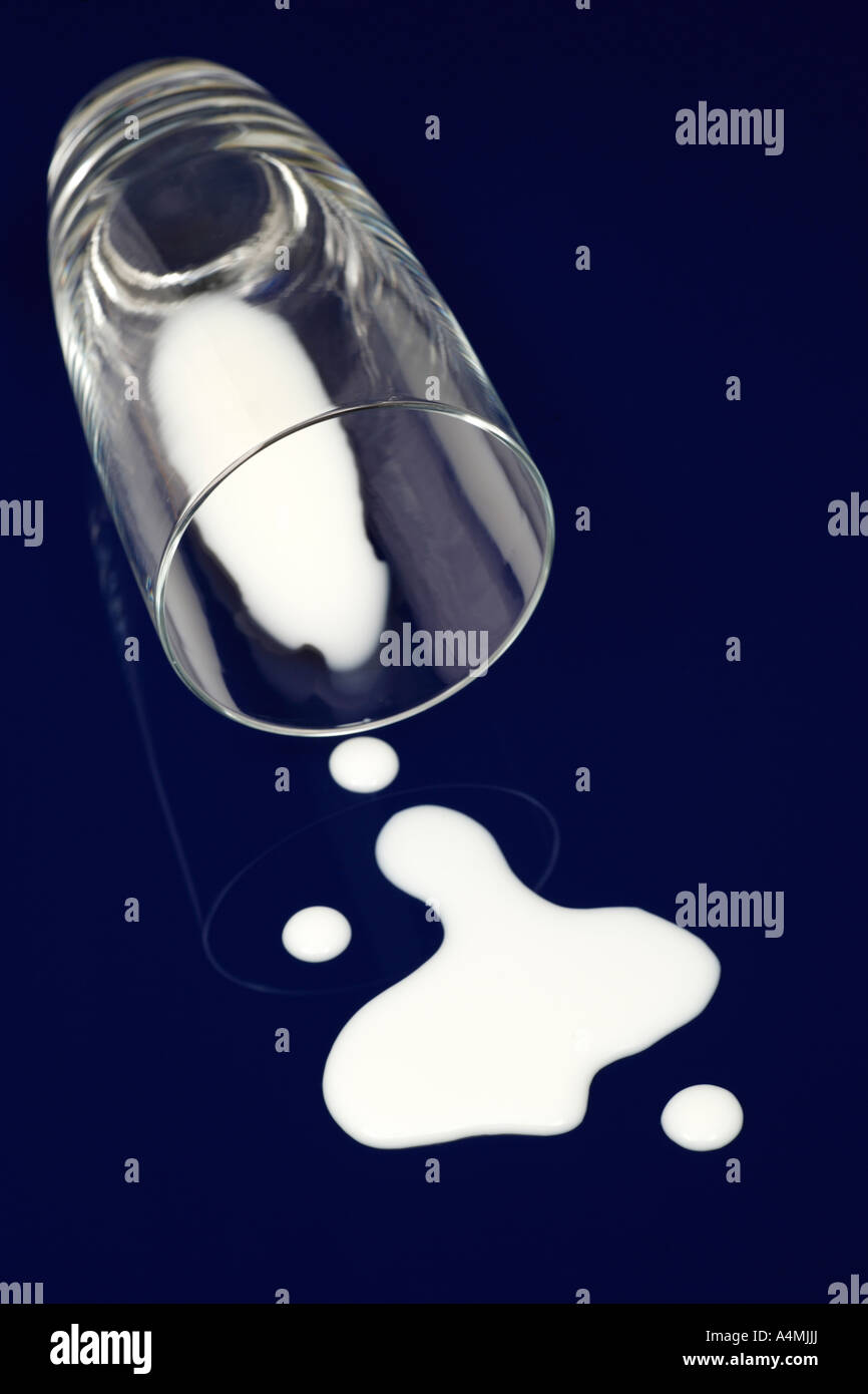 Spilt Glass Of Milk On Dark Blue Background Stock Photo Alamy spilt-glass-of-milk-on-dark-blue-background-stock-photo-alamy