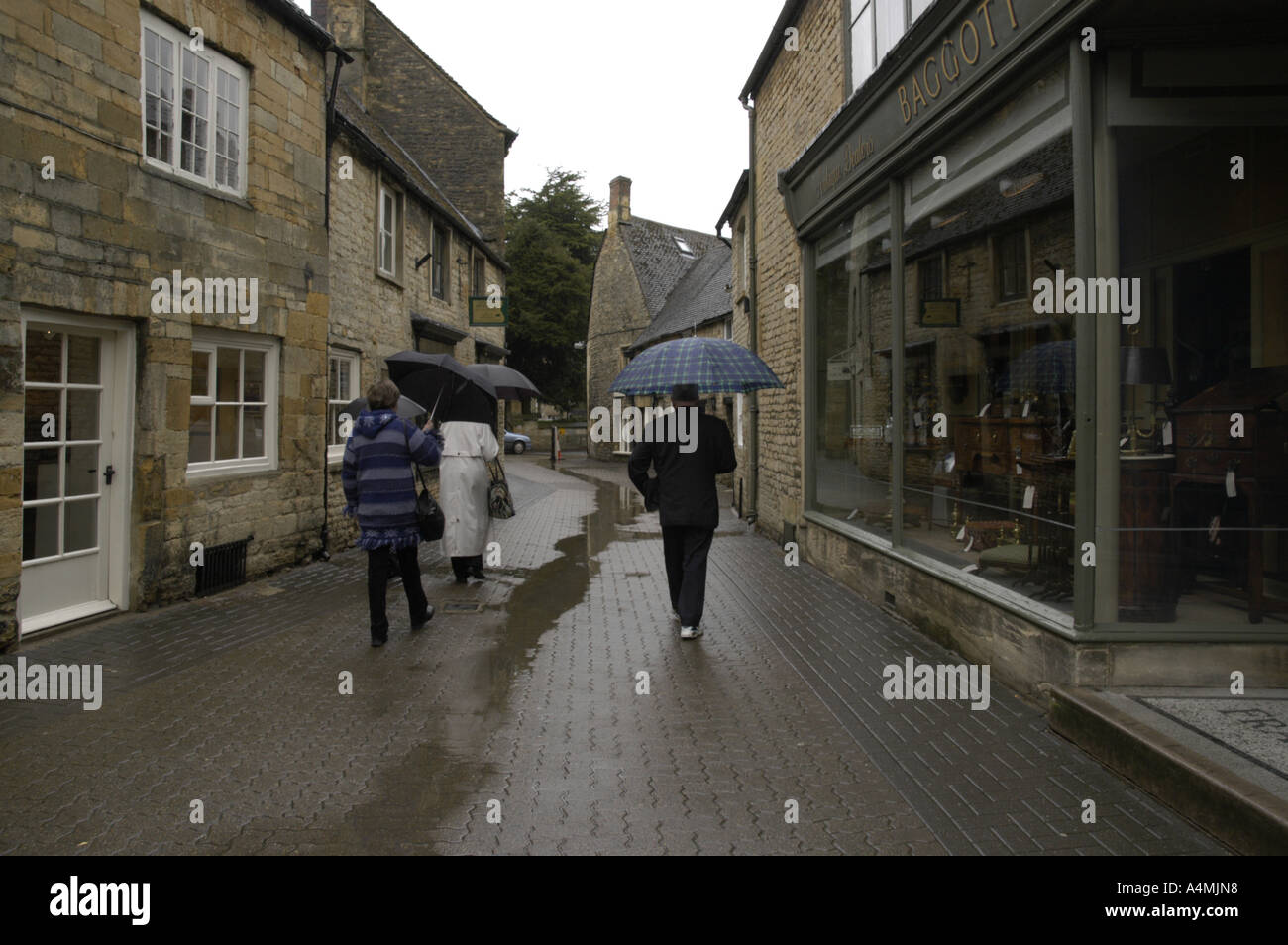 Walking in the rain in the Cotswolds Stock Photo Alamy