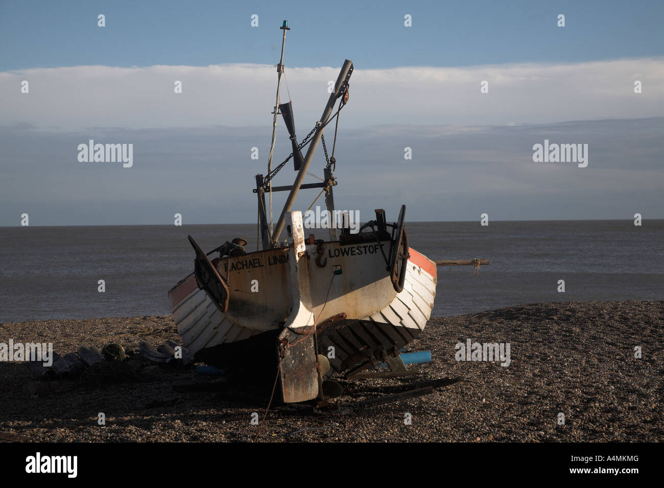 Small Fishing Boat On Shingle Beach With Sea Clouds And Blue Sky In Stock Photo Alamy Small Fishing Boat On Shingle Beach With Sea Clouds And Blue Sky In Stock Photo Alamy