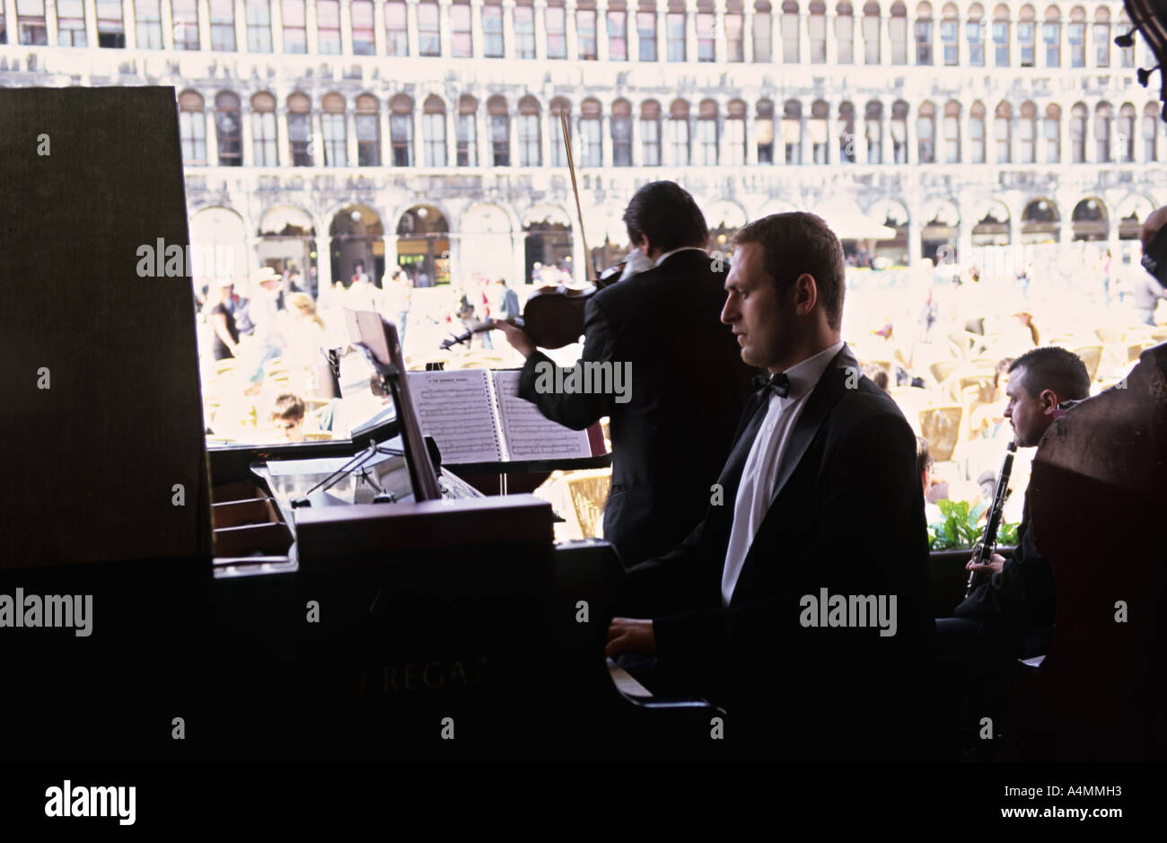 Classical musicians performing at Cafe Florian in Piazza San Marco also known as Saint Mark s Square. Venice, Italy Stock Photo