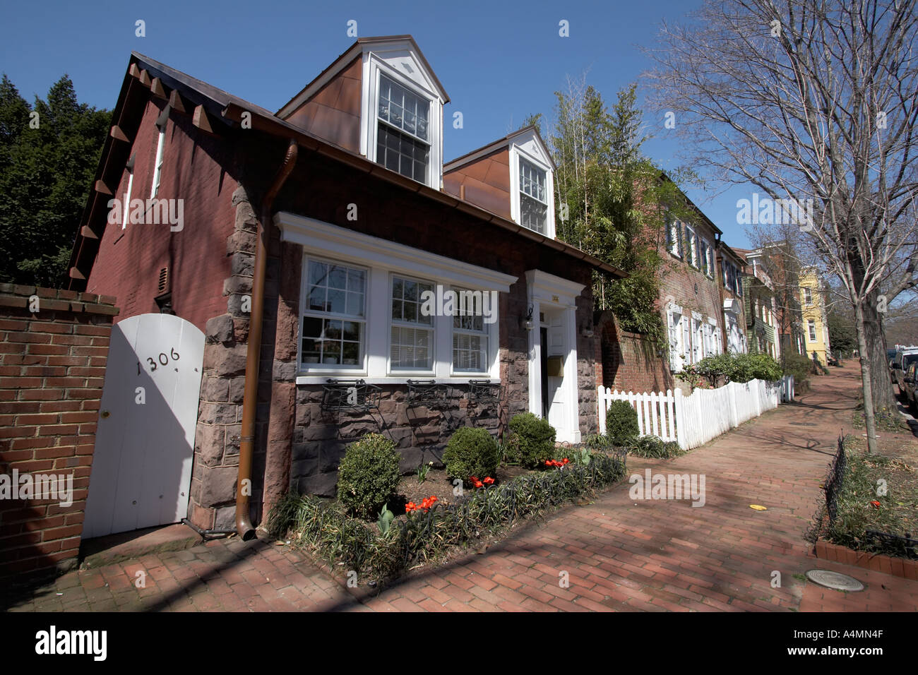 Small brick and stone home with dormers on quiet residential street in Georgetown Washington DC USA Stock Photo