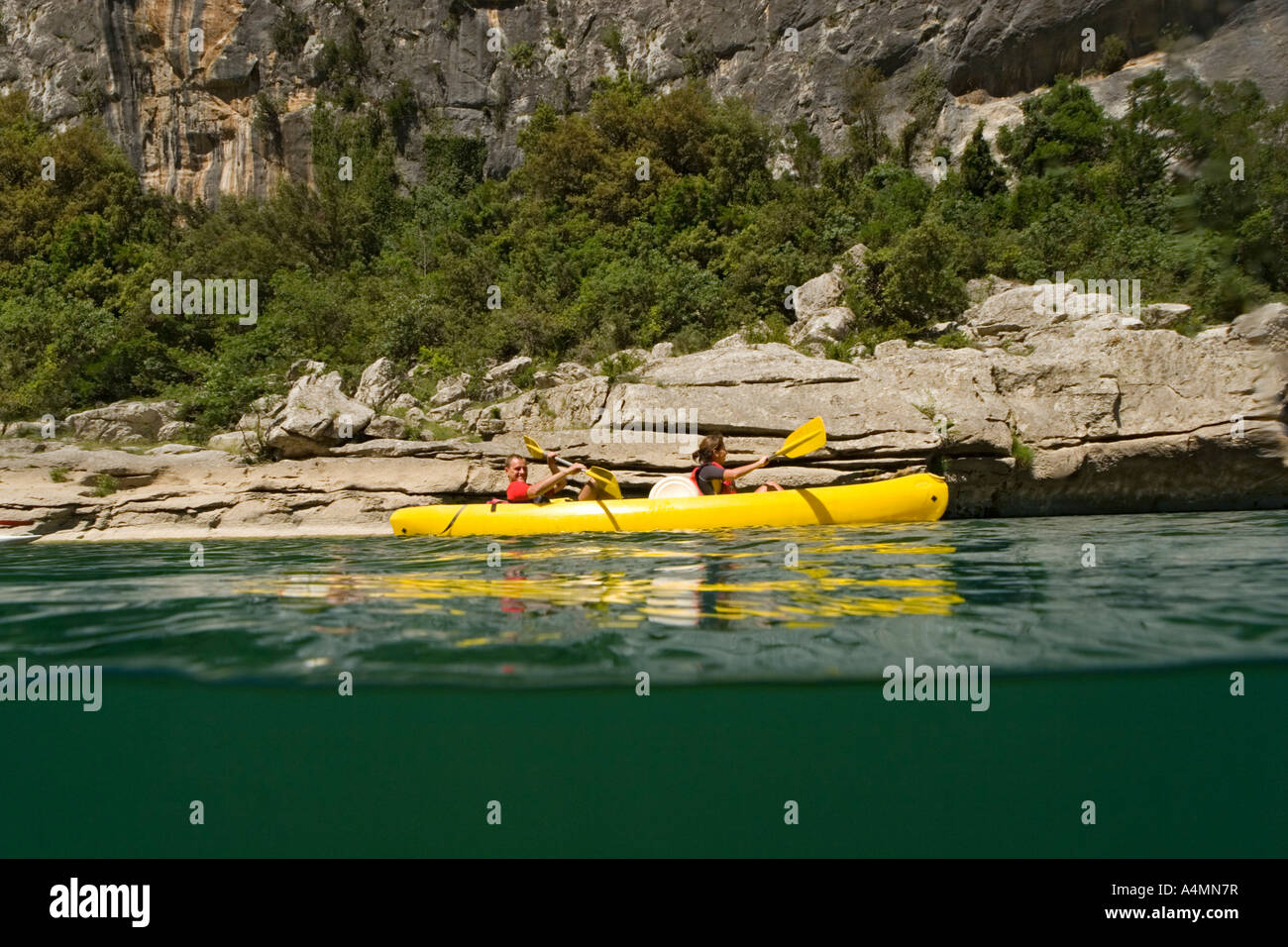 Going down the gorges of the Ardeche river in a canoe (France). Descente des Gorges de l'Ardèche en canoë (France). Stock Photo